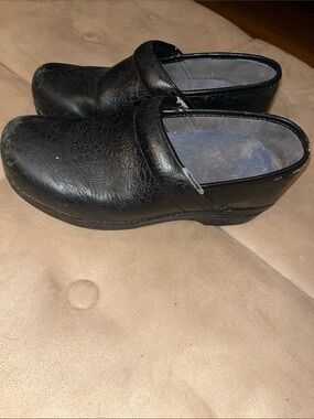 Dansko Black Floral-Embossed Slip-On Clogs